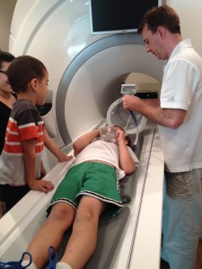 A child lies down for an MRI scan