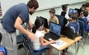 Children work on an activity in a computer lab